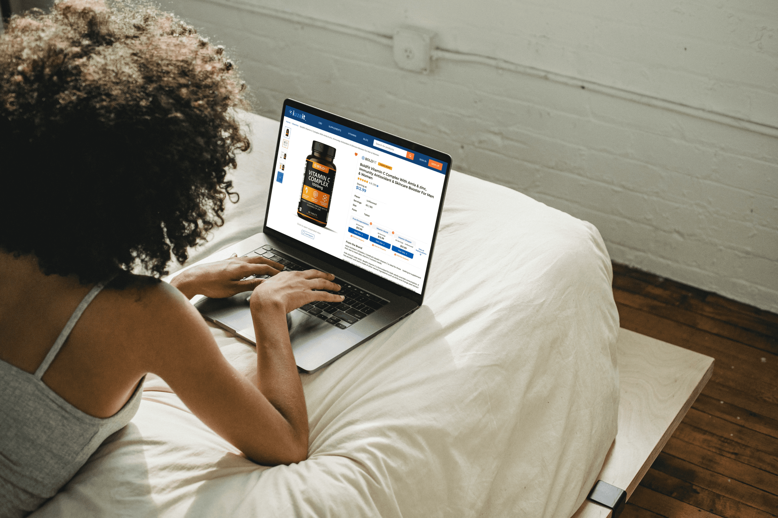 African-American-woman-using-MacBook-Pro-while-lying-on-the-bed_Product_-Brand-Page-CTA-Desktop (1)